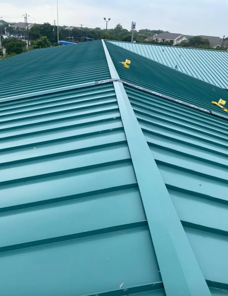 Green commercial metal roof ridge and valley for Metal Roof Repair in De Witt